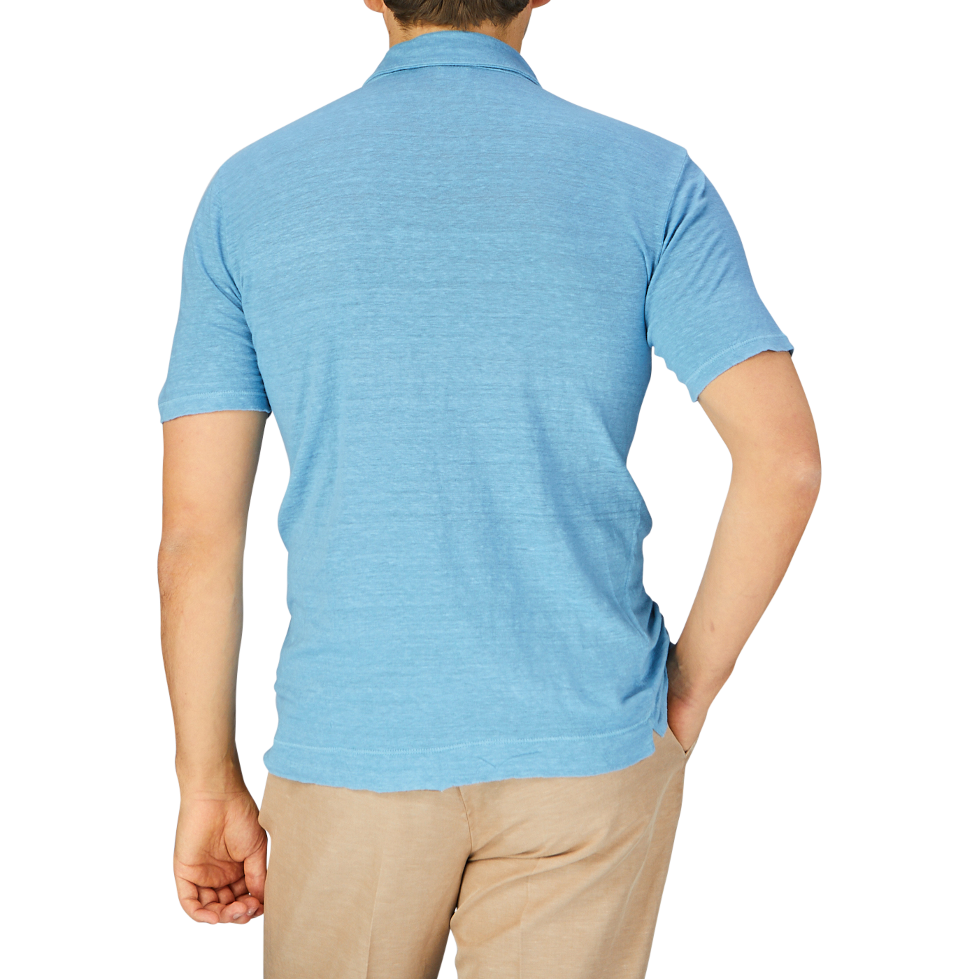 Rear view of a man wearing an Aqua Blue Linen Polo Shirt by Massimo Alba and beige trousers standing against a grey background.
