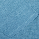 Aqua Blue Linen Polo Shirt from Massimo Alba, with a folded corner, dyed using natural chemical-free pigments.