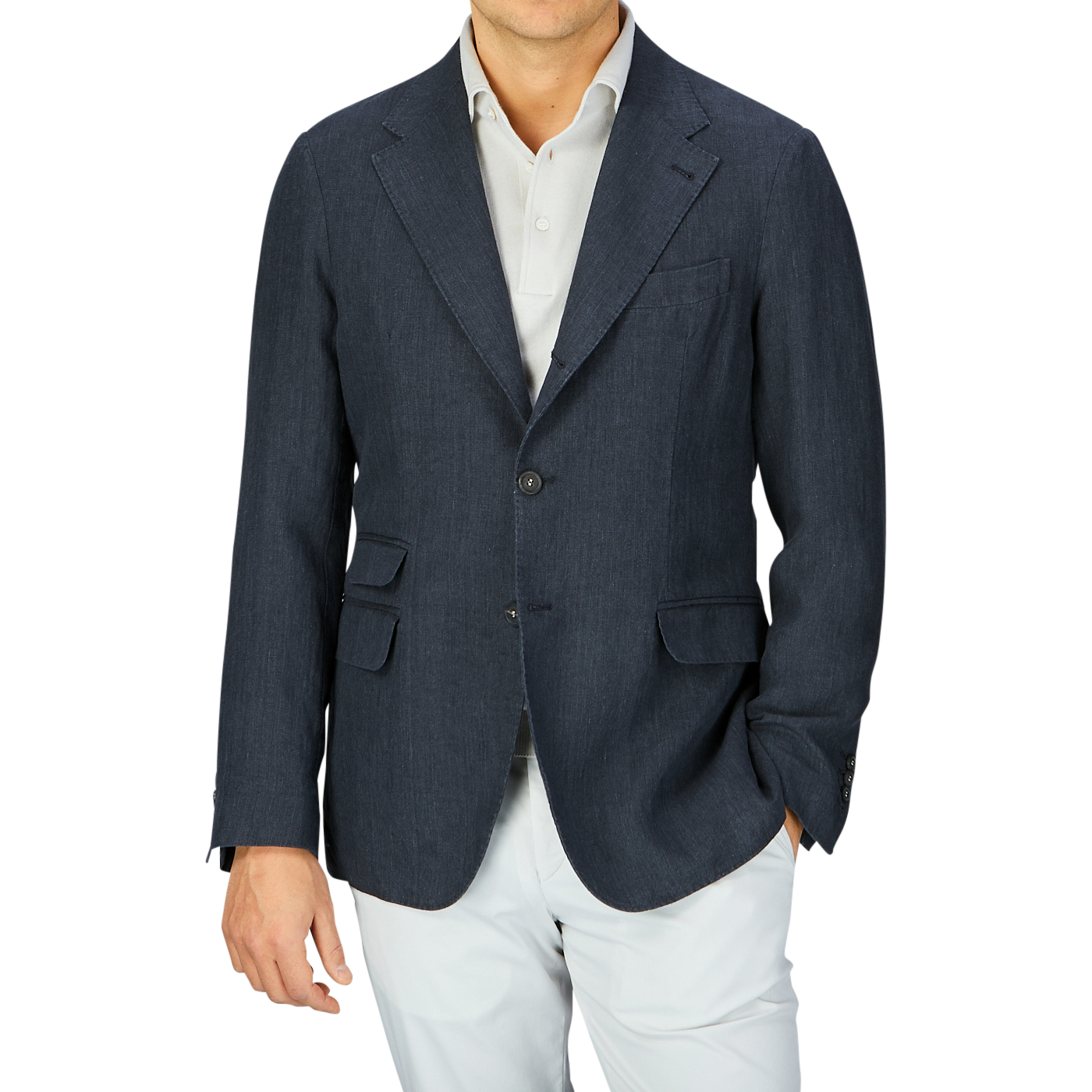 A man wearing a Massimo Alba Black Washed Linen Unstructured Blazer and white pants against a grey background.
