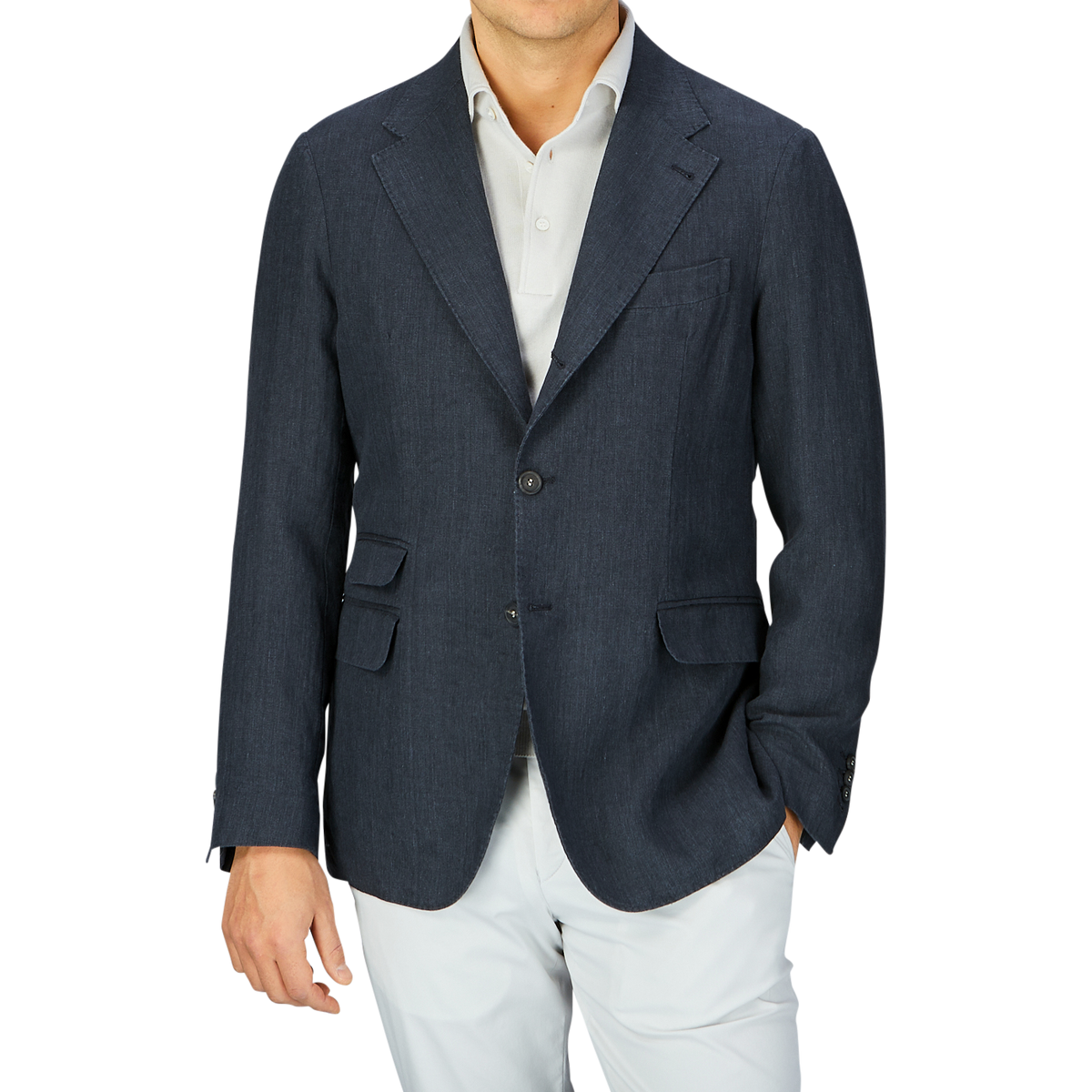 A man wearing a Massimo Alba Black Washed Linen Unstructured Blazer and white pants against a grey background.