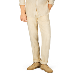 A person wearing Light Beige Linen Casual Trousers and a pure linen canvas shirt by Massimo Alba, standing against a light background.