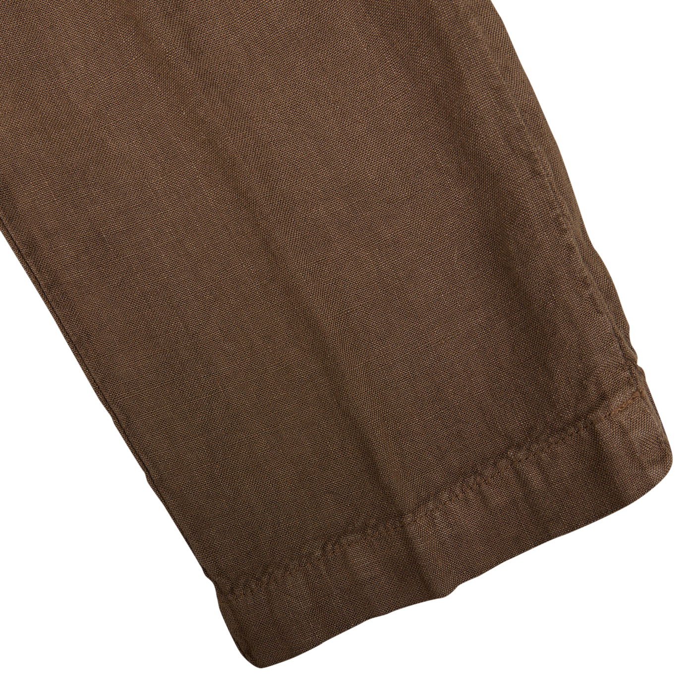 Close-up of a folded light brown Massimo Alba linen casual trousers made from pure linen canvas with visible texture.