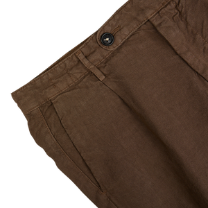 Close-up view of a light brown Massimo Alba linen casual trousers waistband with button closure, made in Italy.