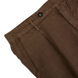 Close-up view of a light brown Massimo Alba linen casual trousers waistband with button closure, made in Italy.