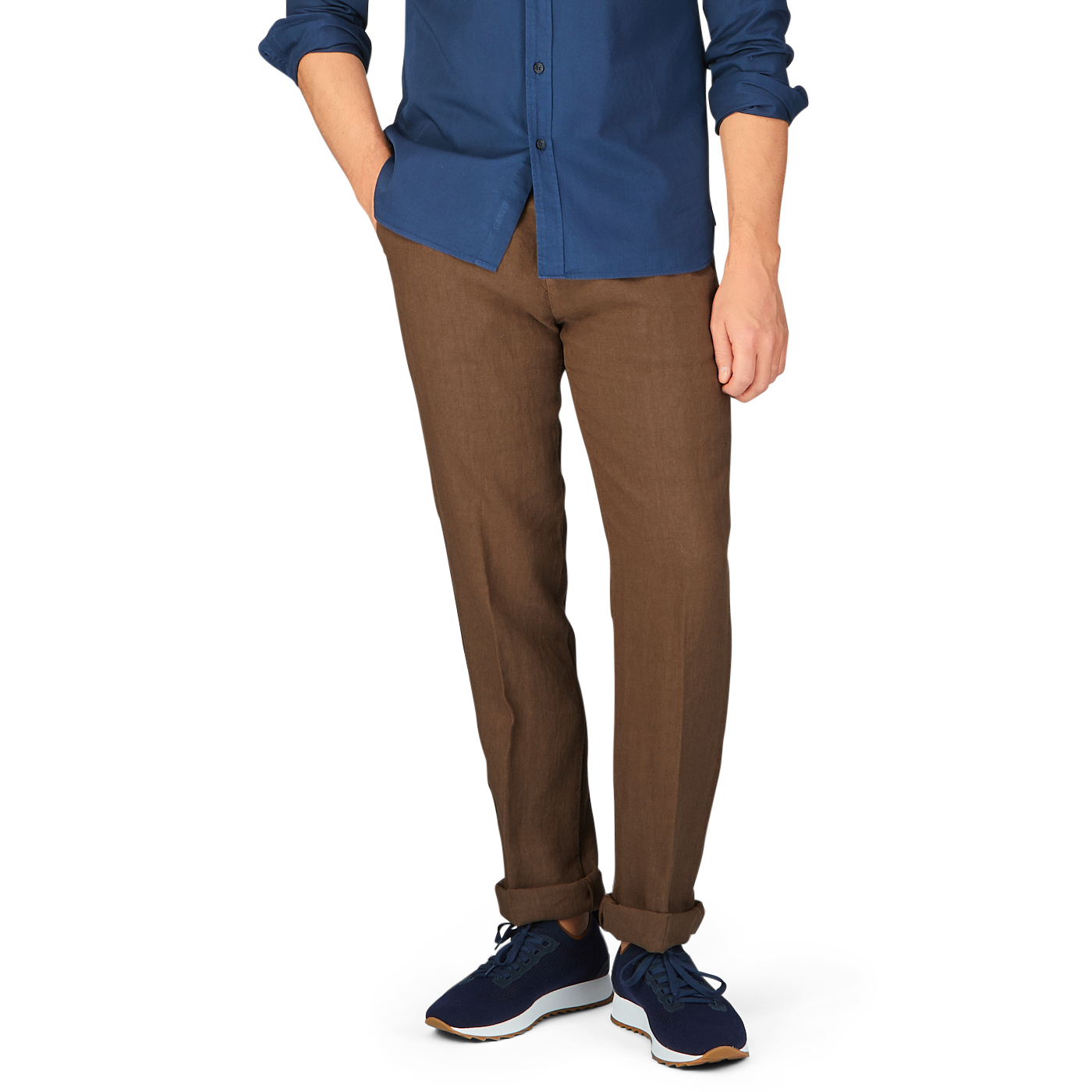 Lower body of a person dressed in Massimo Alba Light Brown Linen Casual Trousers made in Italy, and blue sneakers, with the upper body cropped out of the image.