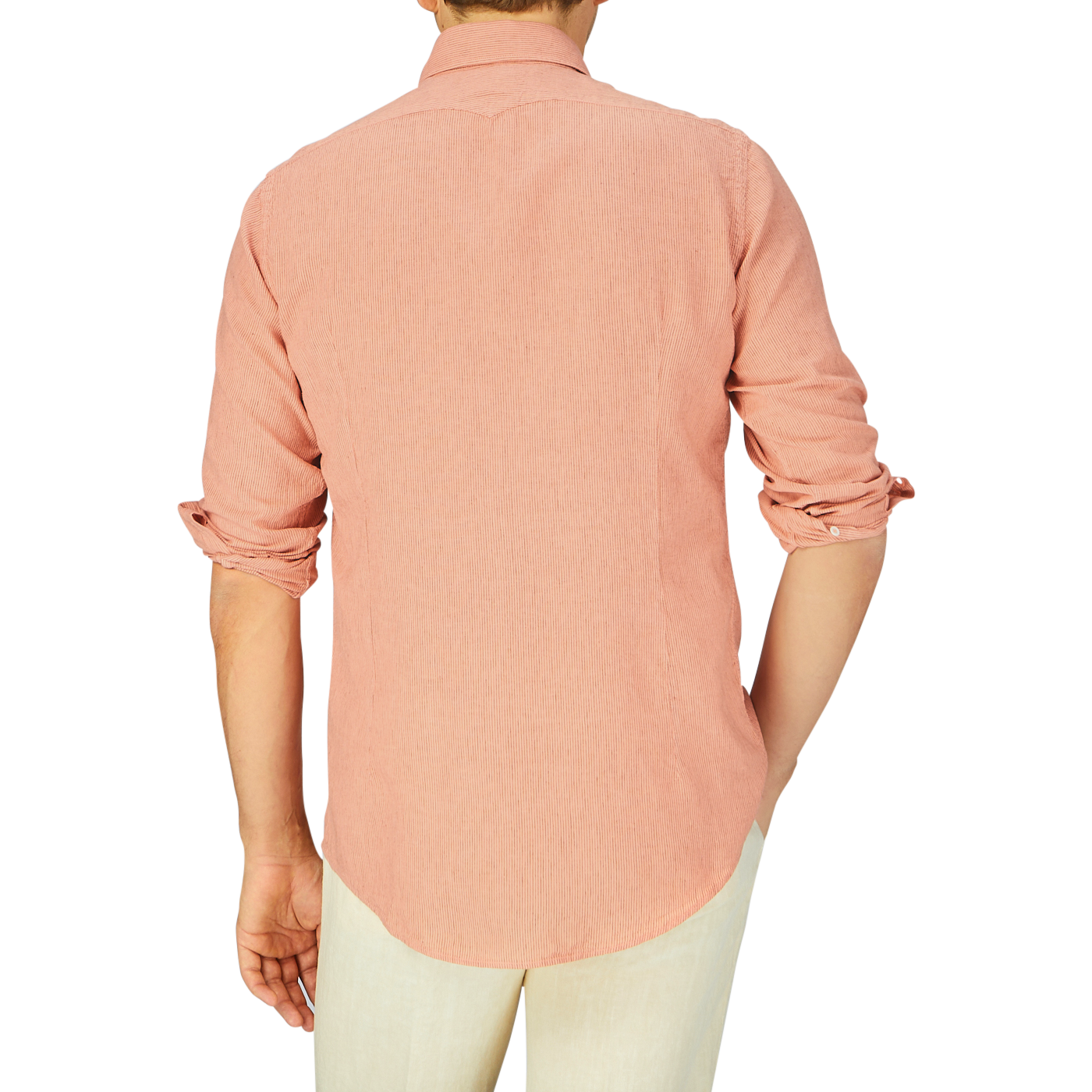 A person standing with their back to the camera, wearing a pink Massimo Alba Peach Orange Striped Cotton Linen Genova Shirt with rolled-up sleeves.