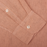 Close-up of a pink Massimo Alba Peach Orange Striped Cotton Linen Genova Shirt with ribbed texture and two buttons.