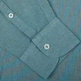 Close-up of a Turquoise Striped Cotton Linen Genova shirt cuff with a white button, made in Italy by Massimo Alba.