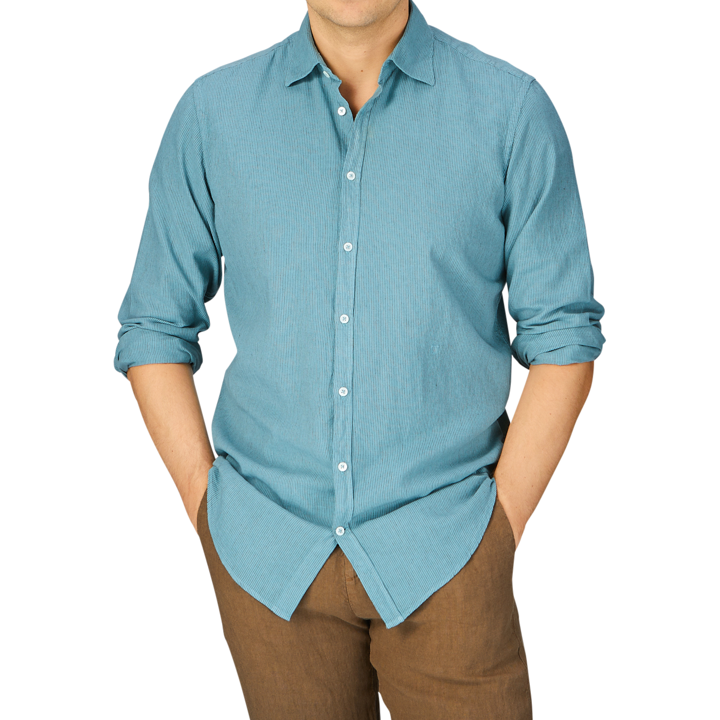 Man in a Massimo Alba Turquoise Striped Cotton Linen Genova Shirt, made in Italy, with sleeves rolled up, paired with brown trousers cropped at the mid-torso.