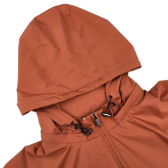 The Maurizio Baldassari Terracotta Brown Nylon Hooded Blouson Jacket features a removable hood with adjustable drawstrings and a front zipper, crafted from technical nylon.