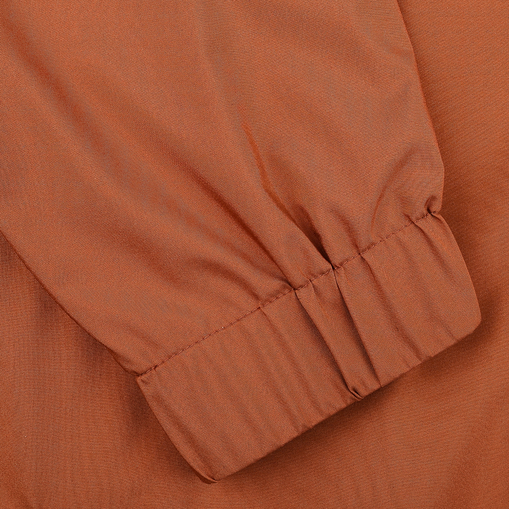 Close-up of a long sleeve with an elastic cuff on the Maurizio Baldassari Terracotta Brown Nylon Hooded Blouson Jacket.