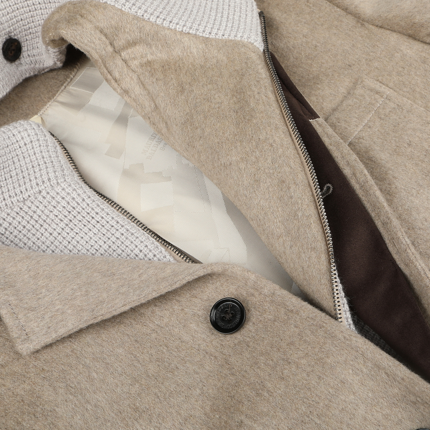 Close-up of the Maurizio Baldassari Beige Cashmere Half Padded Chore Coat showing its inner lining, zipper, and button details, featuring Thermore technical down for added warmth.