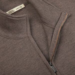 A close up of a Maurizio Baldassari dark beige Milano stitch wool zip gilet.