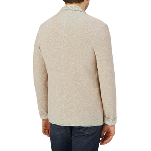 The back view of a man wearing a Maurizio Baldassari Beige Melange Cotton Mouline Knitted Jacket.