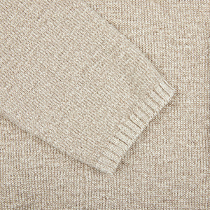 A close up image of a Maurizio Baldassari Beige Melange Cotton Mouline Knitted Jacket.