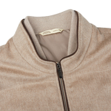 A Maurizio Baldassari Beige Water Repellent Pure Cashmere Gilet with a zipper on the front.