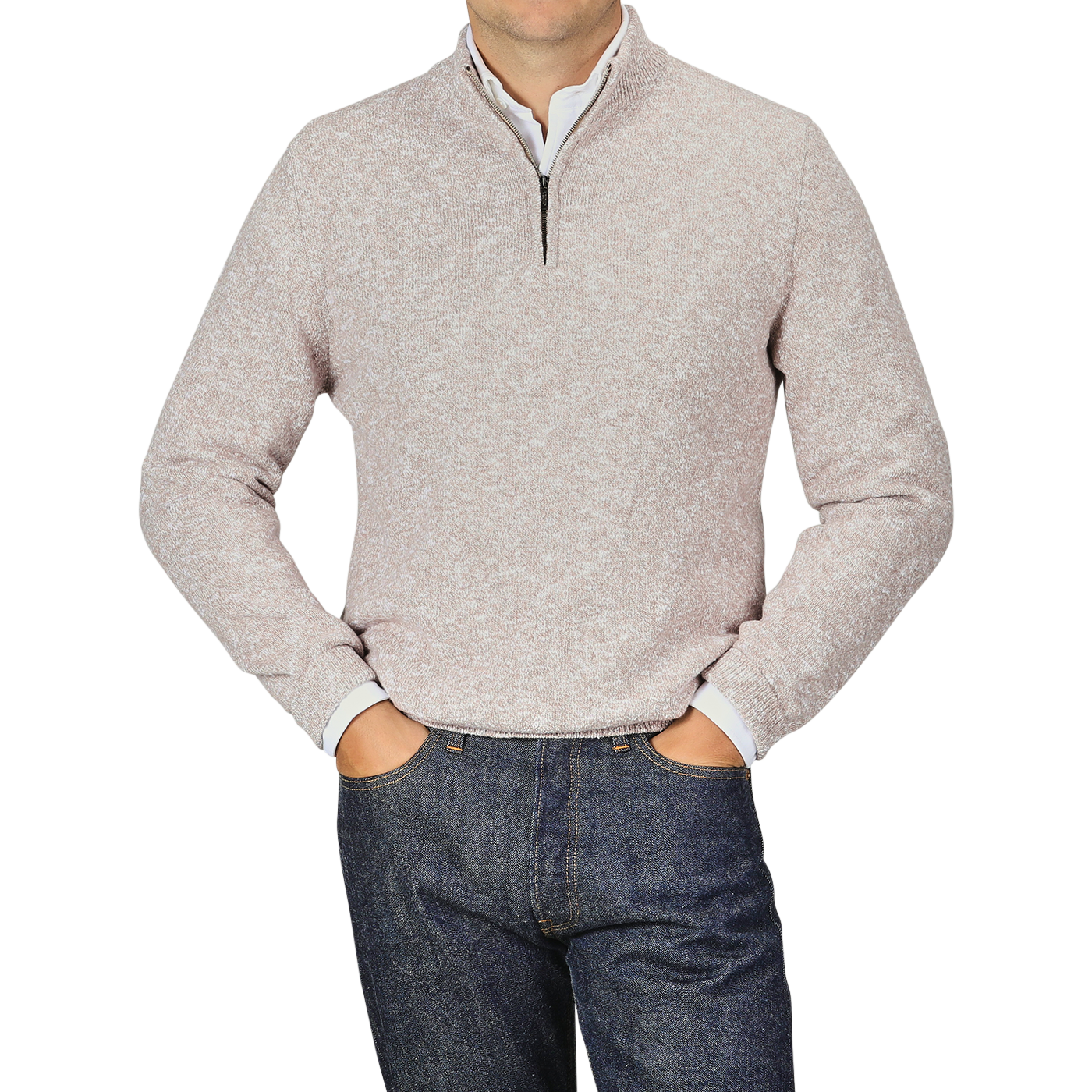 A person is wearing a Beige Winter Wool Mouline 1/4 Zip Sweater by Maurizio Baldassari and dark blue jeans, with their hands resting in their pockets. The background is a plain light gray color.