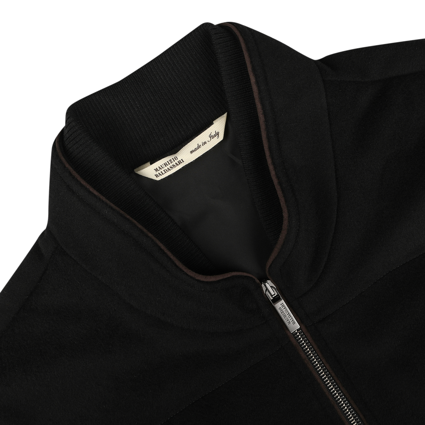 Close-up of a Black Water Repellent Cashmere Gilet with a ribbed collar. A tag inside the gilet reads "Made in Italy by Maurizio Baldassari.