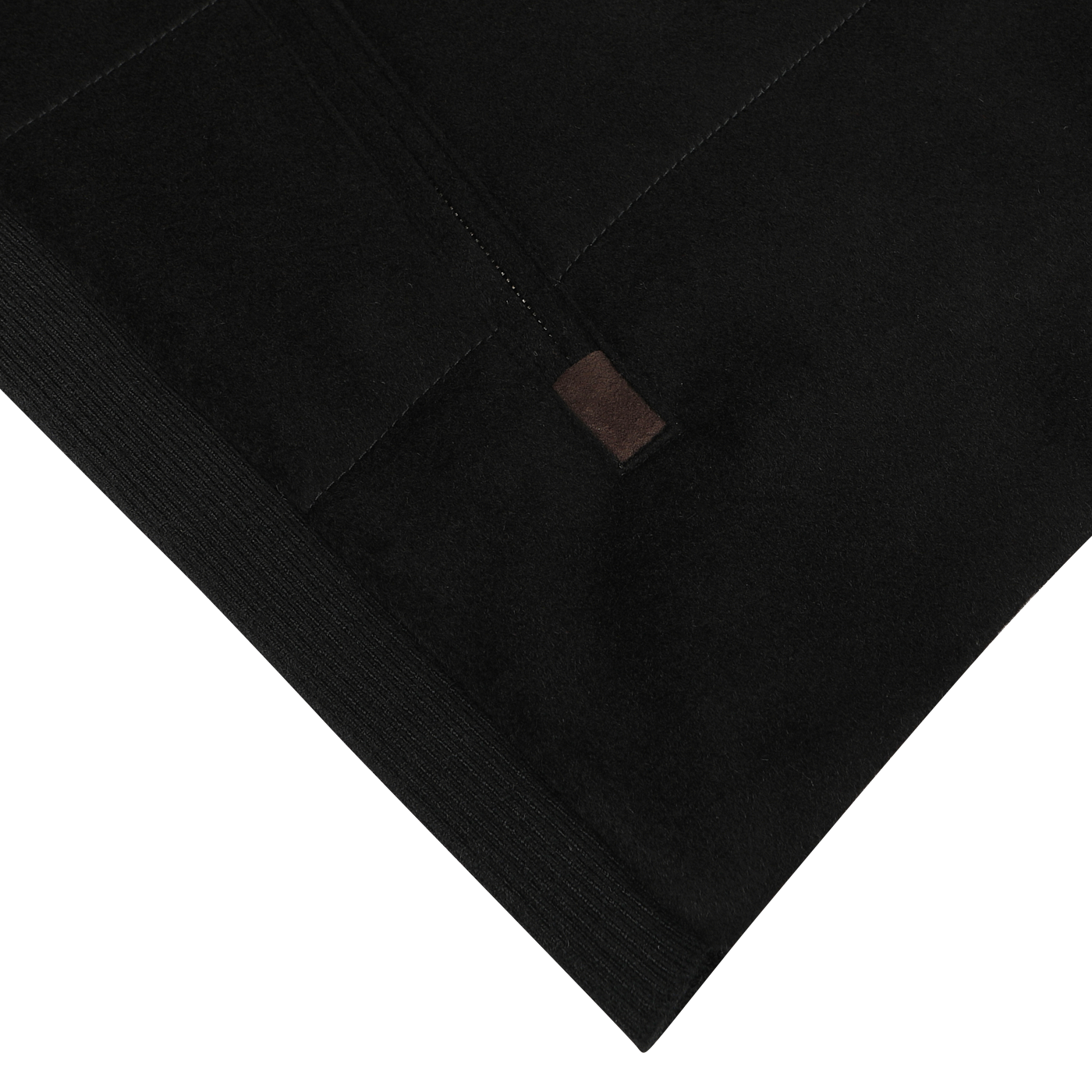 Close-up of a Black Water Repellent Cashmere Gilet with detailed stitching and a small brown tab. The image focuses on the texture and craftsmanship typical of Maurizio Baldassari creations.