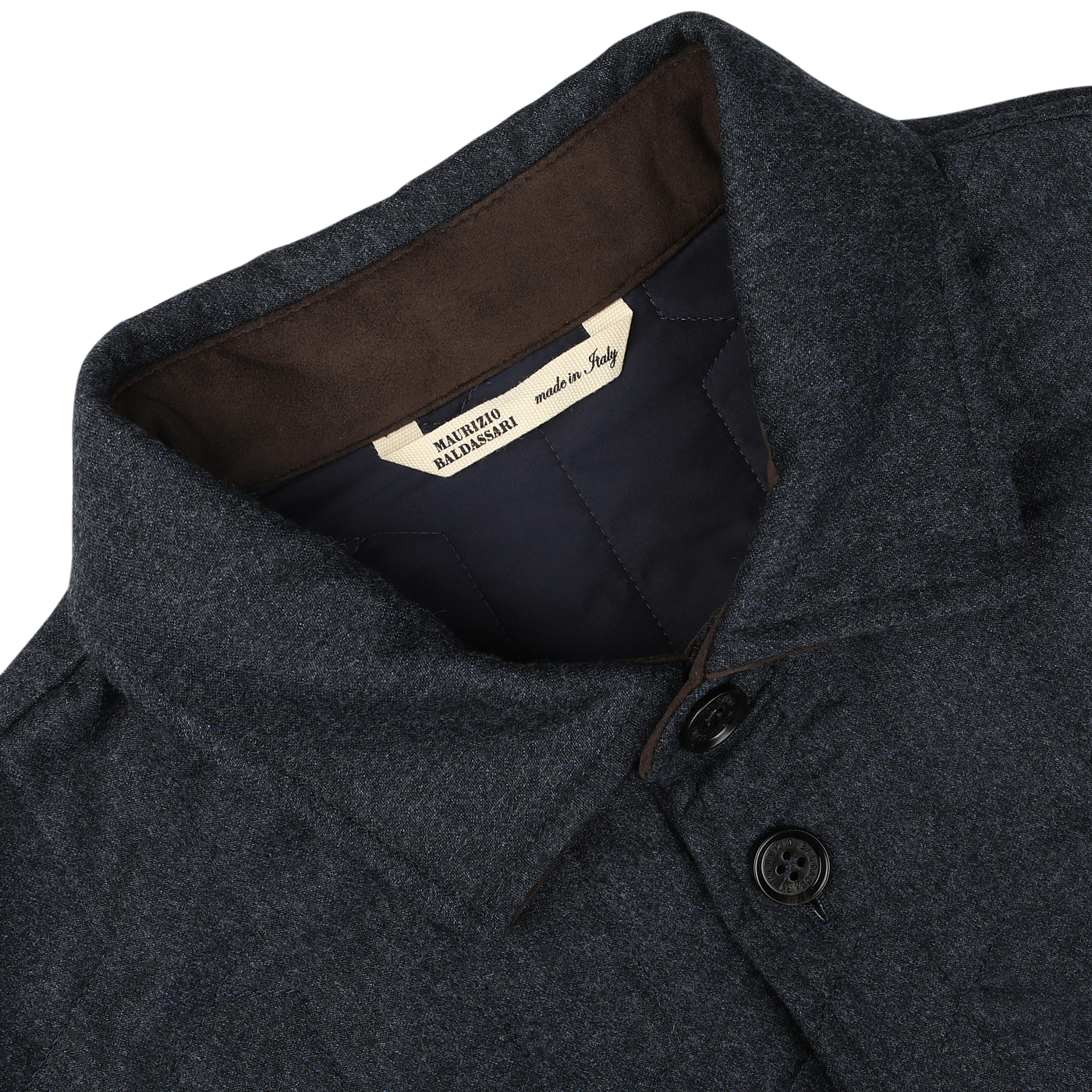 Close-up of a blue melange collared jacket with two buttons, featuring a label inside the collar that reads "Made in Italy." This Maurizio Baldassari overshirt is crafted from virgin wool and boasts sophisticated Thermore padding.