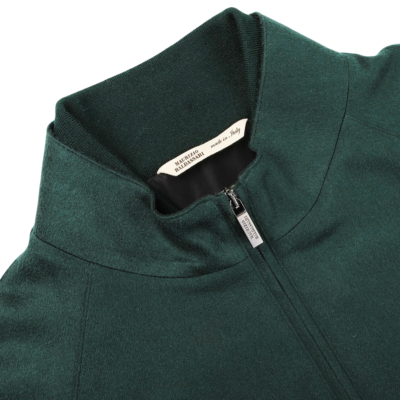 A bottle green cashmere zip blouson jacket from Maurizio Baldassari featuring a visible brand label inside the collar, reading "ALBINI DESIGN MILANO," and a smaller tag indicating it is made in Italy.