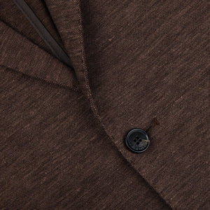 A close up of a Maurizio Baldassari slim fit Brown Melange Wool Linen Silk Jersey Blazer with buttons.