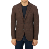 A man wearing a Maurizio Baldassari Brown Melange Wool Linen Silk Jersey Blazer.