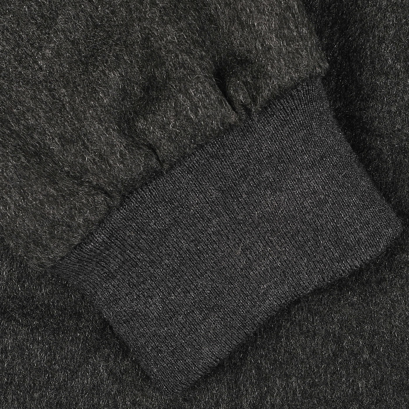 A close-up of the Maurizio Baldassari Charcoal Grey Cashmere Zip Blouson with a ribbed knit cuff.