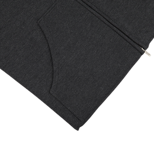 A Maurizio Baldassari Charcoal Grey Milano Stitch Wool Zip Gilet with a zipper on the side.