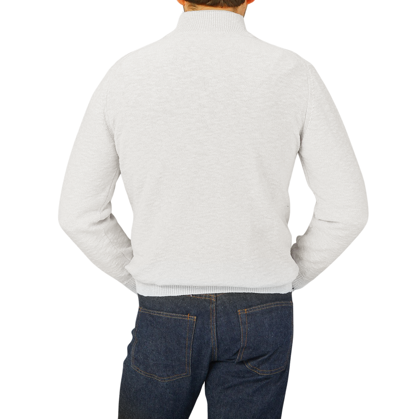 The back view of a man wearing jeans and a Maurizio Baldassari Cream White Cotton Mouline 1/4 Zip Sweater.