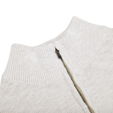 A close up of a Maurizio Baldassari Cream White Cotton Mouline 1/4 Zip Sweater.