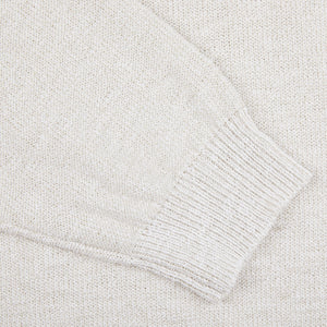 A close up of a cream white Cotton Mouline 1/4 Zip Sweater by Maurizio Baldassari.