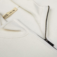 Close-up of a Cream Milano Stitch Wool Zip Gilet from Maurizio Baldassari, featuring a partially open zipper and a visible label that reads "MAURIZIO BALDASSARI made in Italy," crafted from pure virgin wool.