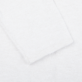 A close up of a Cream White Cotton Mouline Swacket by Maurizio Baldassari on a surface.
