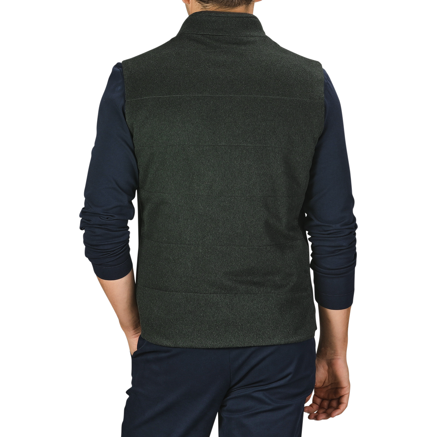 A person is shown from the back, wearing a Dark Green Water Repellent Cashmere Gilet by Maurizio Baldassari and a long-sleeved navy blue shirt with dark pants. The background is plain grey.