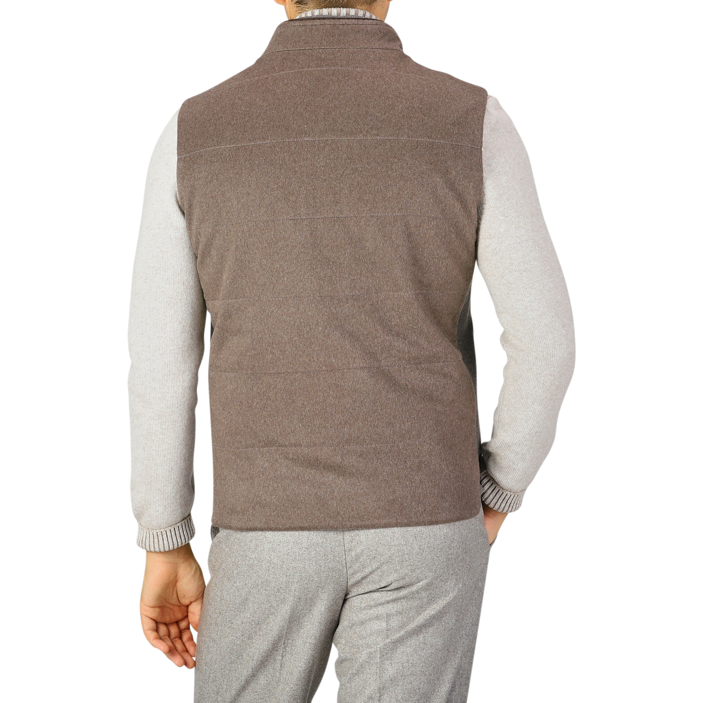 A person is seen from the back, wearing a Maurizio Baldassari Dark Taupe Water Repellent Cashmere Gilet over a light gray long-sleeve shirt and gray pants.