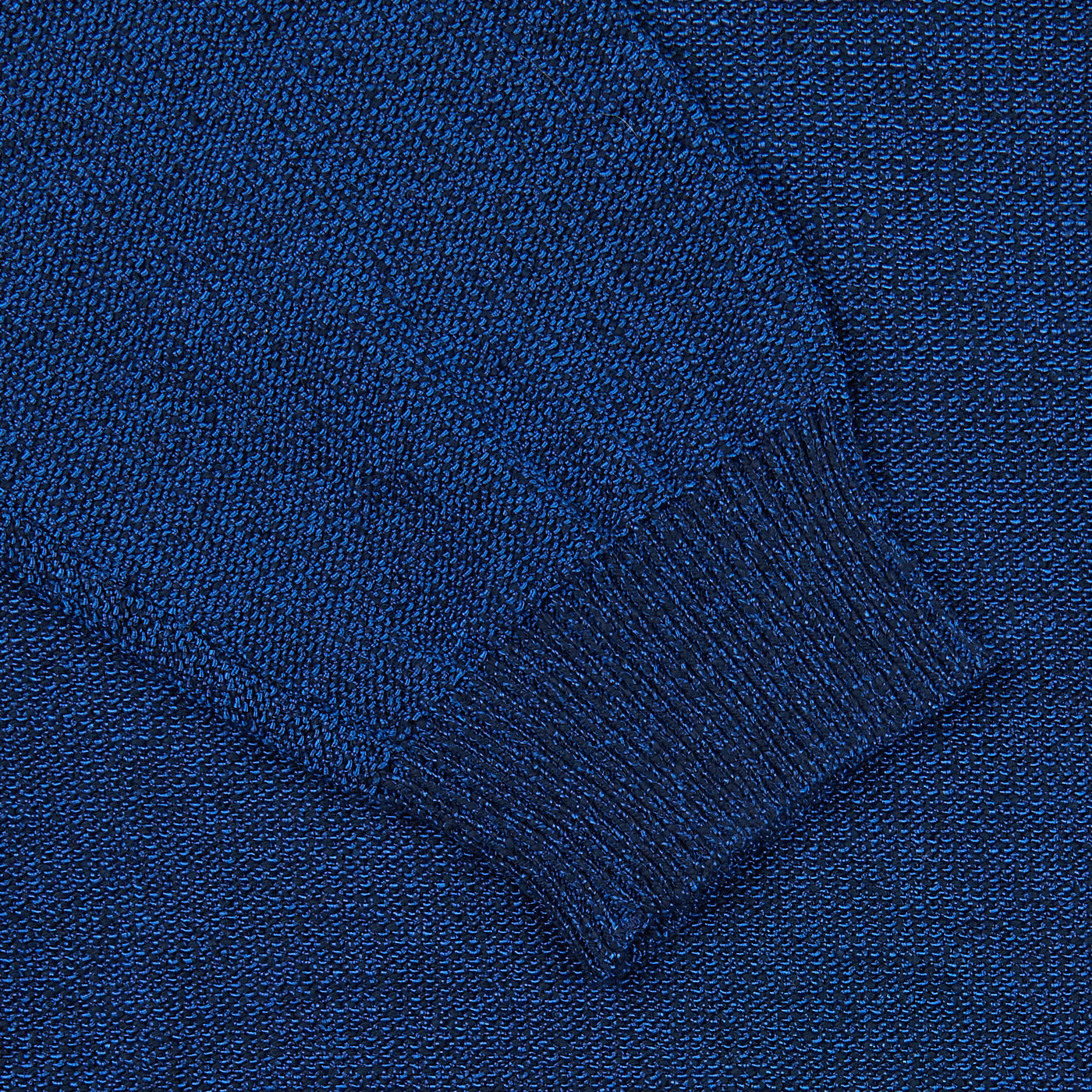 A close up of a Maurizio Baldassari Denim Blue Cotton Mouline 1/4 Zip Sweater.