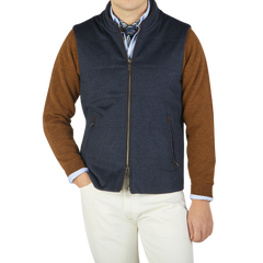 A man wearing a Maurizio Baldassari Denim Blue Water Repellent Pure Cashmere Gilet.