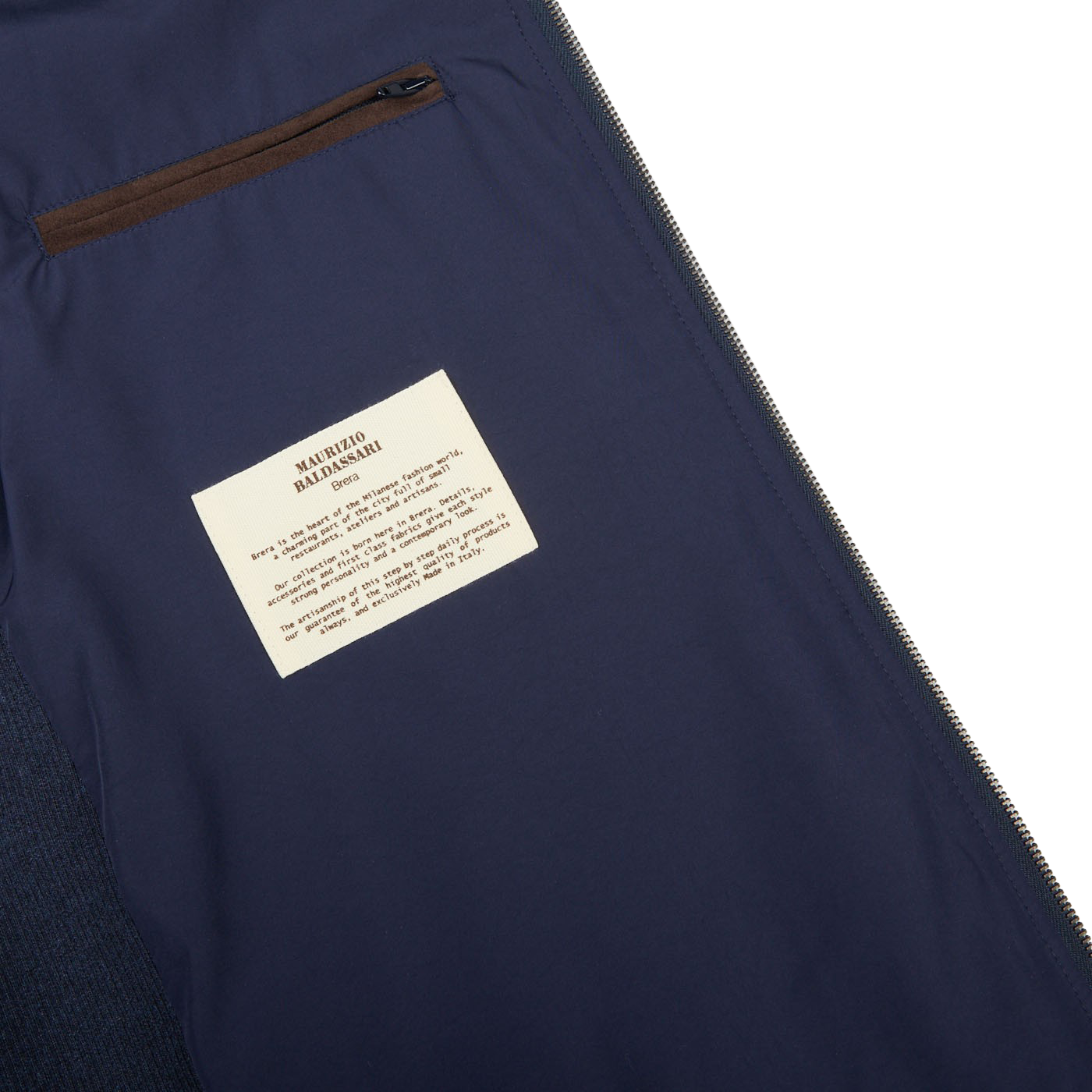 A Maurizio Baldassari Denim Blue Water Repellent Pure Cashmere Gilet with a label on it.