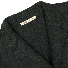 Close-up of a Maurizio Baldassari Green Melange Winter Wool Mouline Swacket's collar and lapel, with a visible label that reads "Made in Italy," highlighting its luxurious wool-cotton blend.