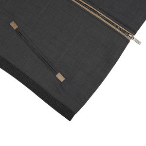 A Charcoal Grey Merino Wool Travel Gilet by Maurizio Baldassari with a zipper on it.
