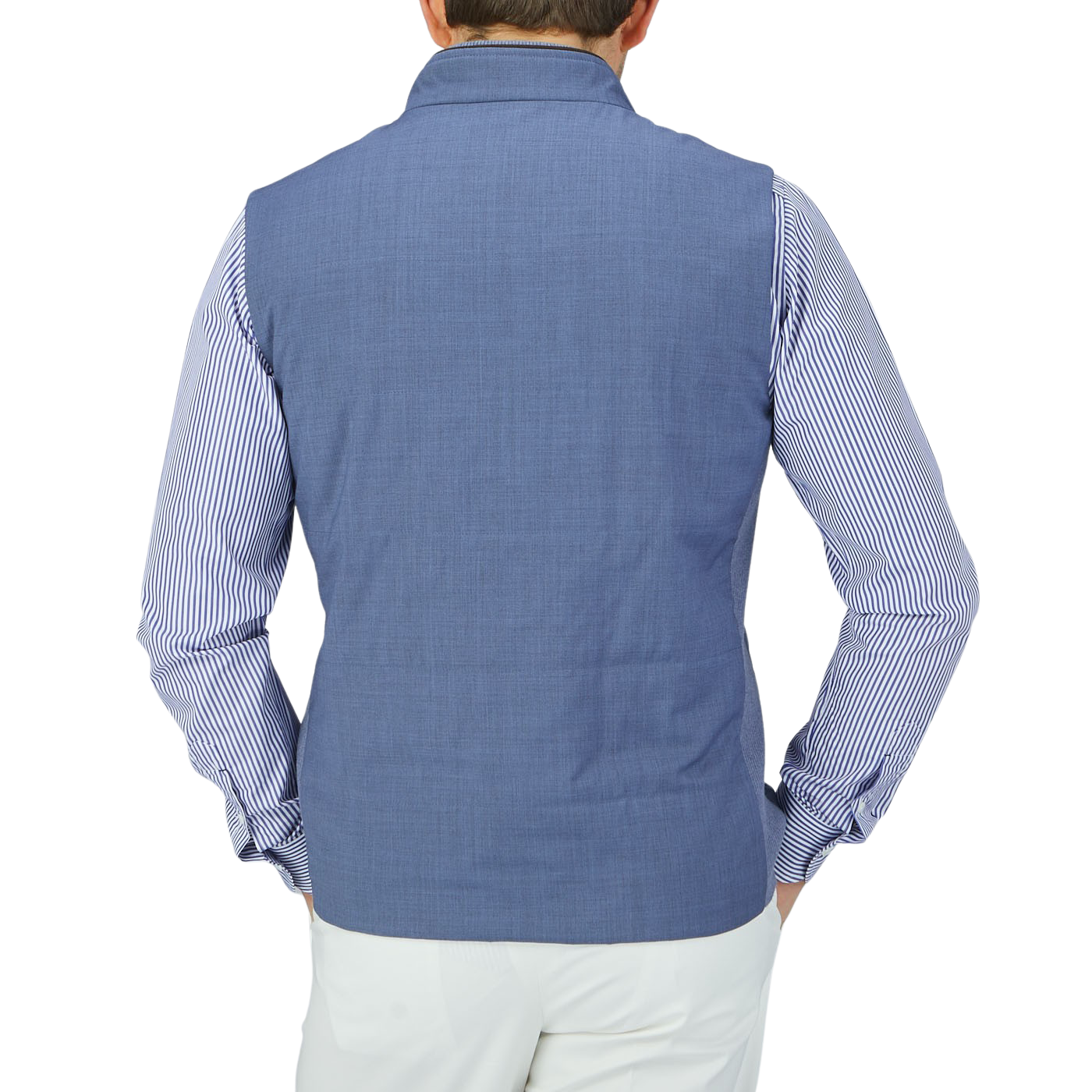 The back view of a man wearing a Maurizio Baldassari Light Blue Merino Wool Travel Gilet.