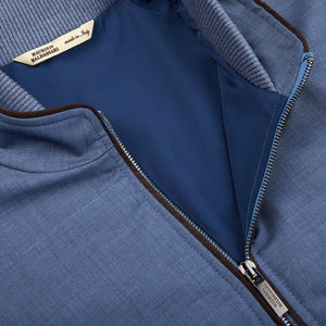 A close up of a Maurizio Baldassari Light Blue Merino Wool Travel Gilet zippered outerwear.