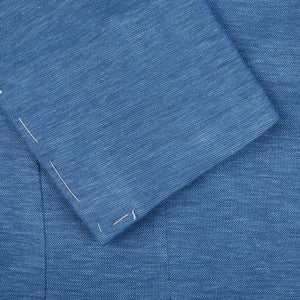 A close up of a Maurizio Baldassari Light Blue Wool Linen Silk Jersey Blazer with stitching on it.