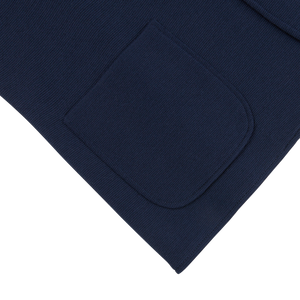 The pocket of a Maurizio Baldassari Navy Blue Merino Wool Milano Stitch Swacket with a regular fit.
