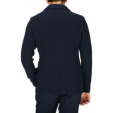 The back view of a man wearing a Maurizio Baldassari Navy Blue Organic Cotton Rib Stitched Swacket.