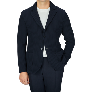 A man wearing a Maurizio Baldassari Navy Blue Organic Cotton Rib Stitched Swacket and pants.