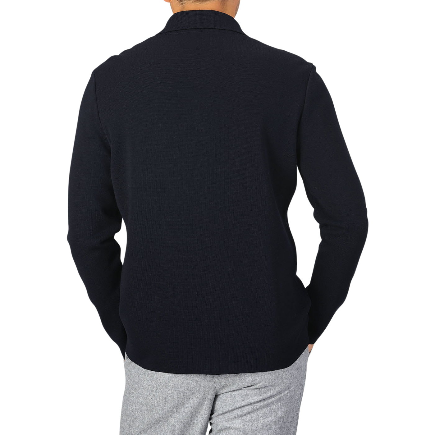 A person wearing a long-sleeved, Navy Blue Wool Milano Knitted Overshirt by Maurizio Baldassari and light gray pants, photographed from the back.