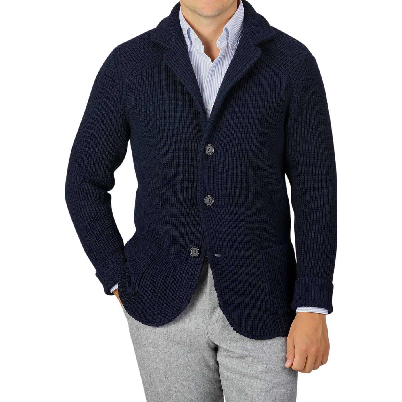 A person wearing a Maurizio Baldassari Navy Blue Zegna Baruffa Wool Brenta Jacket over a white and blue striped shirt and gray trousers, showcasing exceptional craftsmanship. The face is not visible.