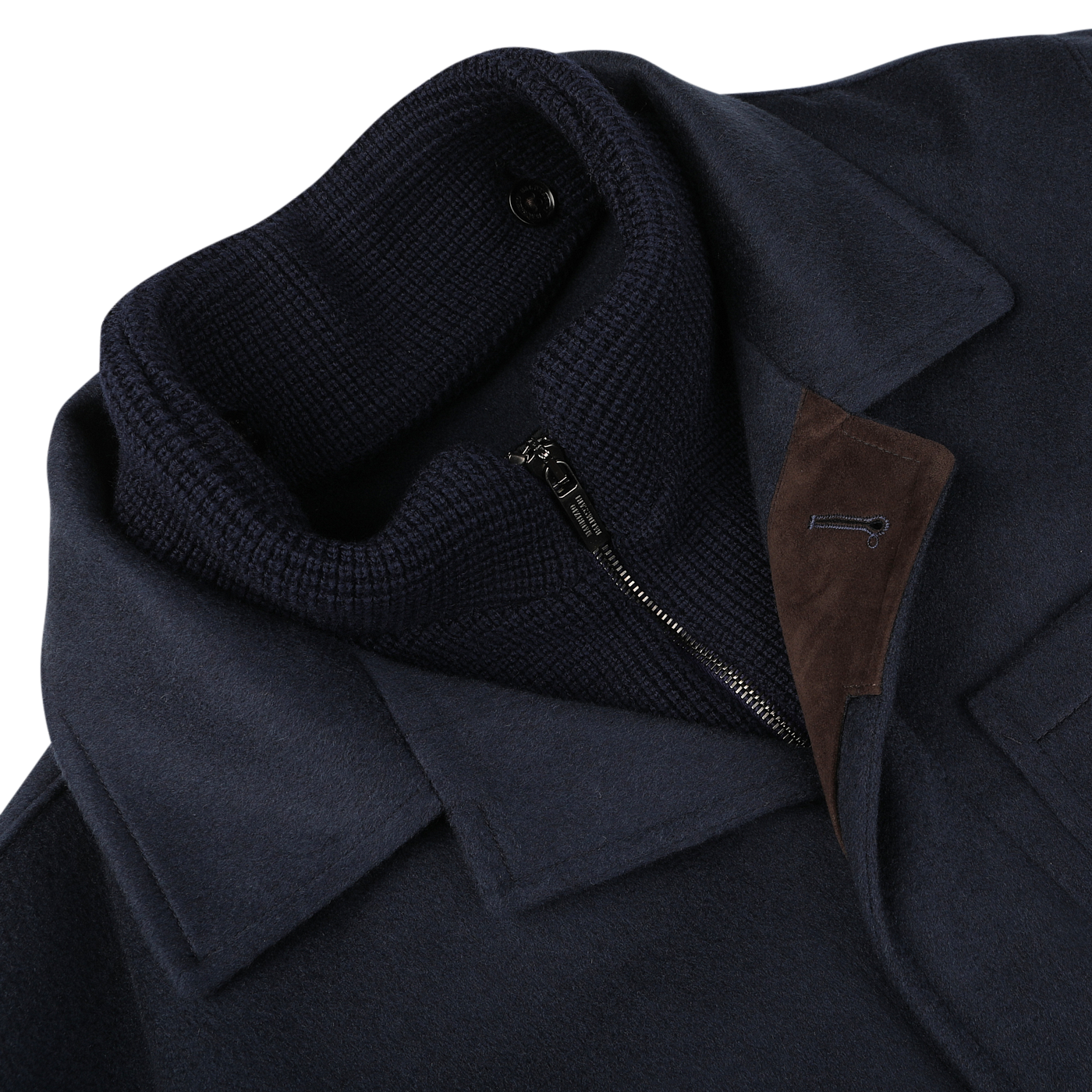 Close-up of the Navy Cashmere Half Padded Chore Coat by Maurizio Baldassari, featuring a high ribbed collar, a partially open zipper, and a brown suede accent near the lapel. The inclusion of Thermore technical down ensures optimal warmth and comfort.